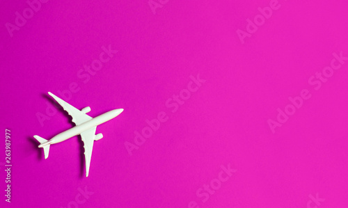 Travel concept on pink background.