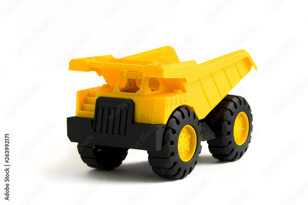 yellow plastic  dump truck toy on white background