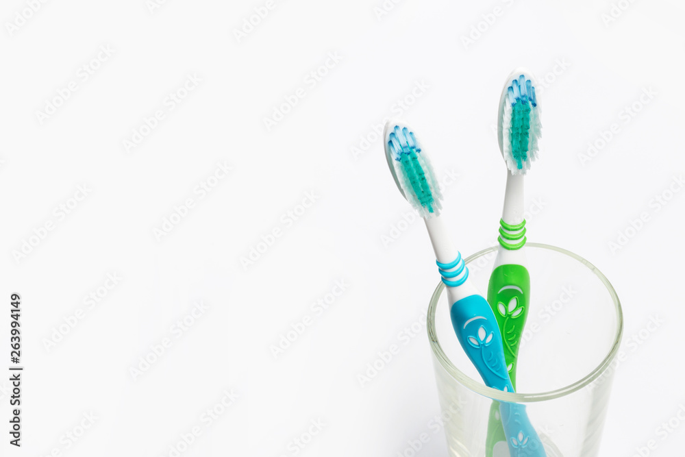 Set of toothbrushes in glass on white background. Set of toothbrushes in glass on white background.