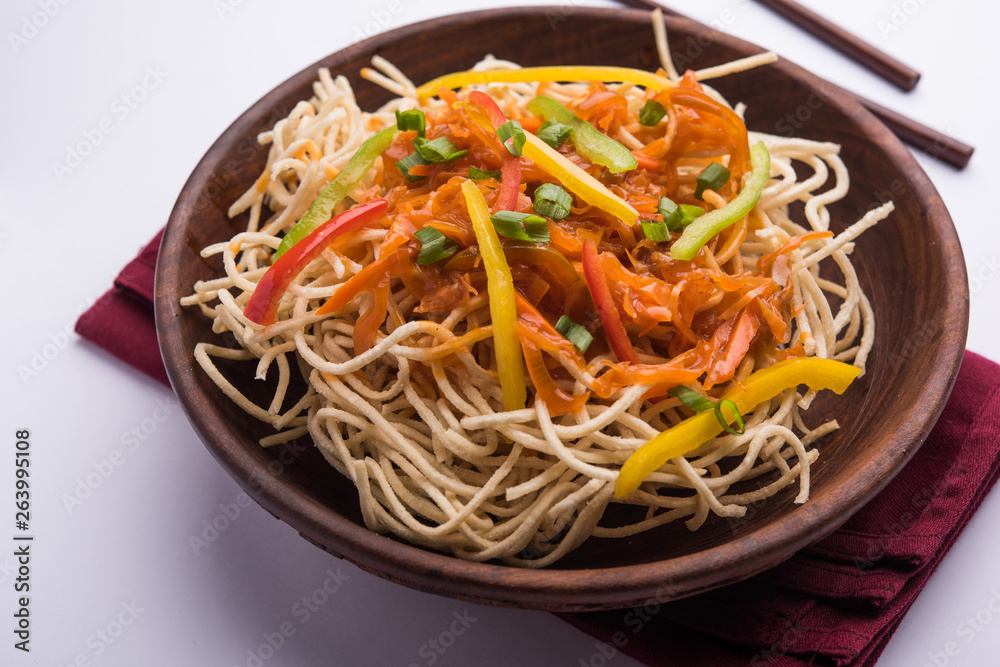 American chop suey/ chopsuey is a popular indochinese food. served in a bowl with chop sticks. selective focus American chop suey/ chopsuey is a popular indochinese food. served in a bowl with chop sticks. selective focus