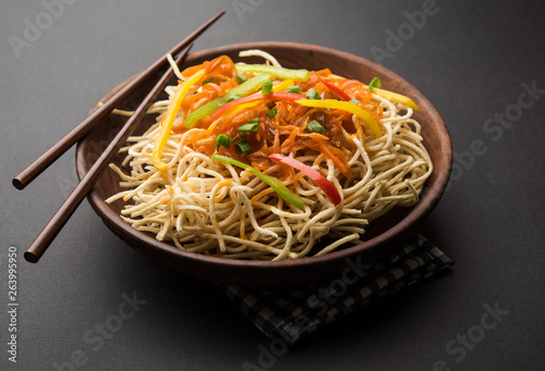 American chop suey/ chopsuey is a popular indochinese food. served in a bowl with chop sticks. selective focus photo