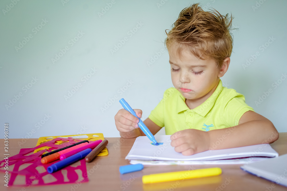 Little boy drawing with color crayons Little boy drawing with color crayons