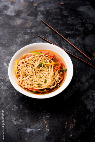 American chop suey/ chopsuey is a popular indochinese food. served in a bowl with chop sticks. selective focus photo