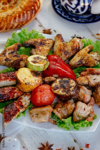Meat plate - grilled kebabs from chiken meat, with grilled vegetables.