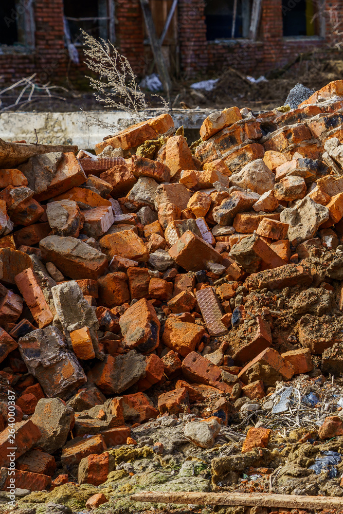 bunch of broken red bricks and other debris