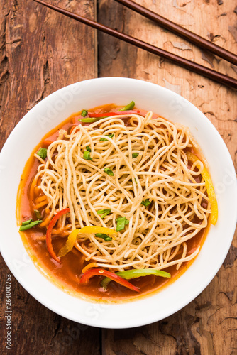 American chop suey/ chopsuey is a popular indochinese food. served in a bowl with chop sticks. selective focus