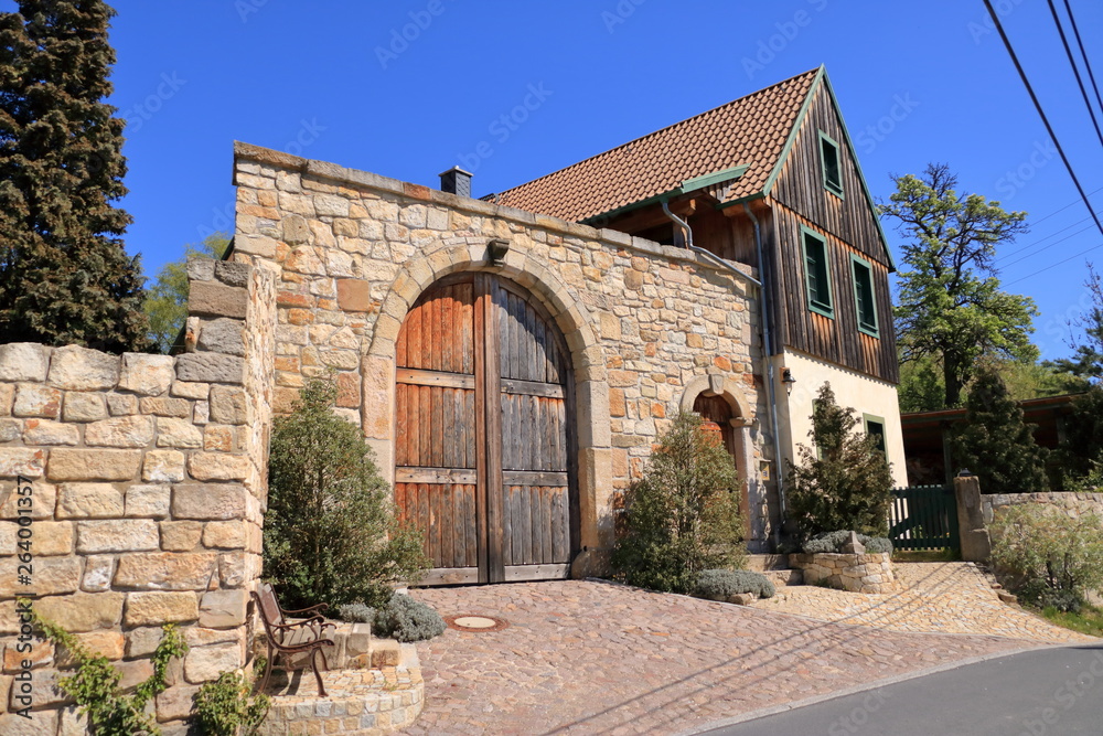 Old Grunge countryside wood door and sandstone wall Old Grunge countryside wood door and sandstone wall