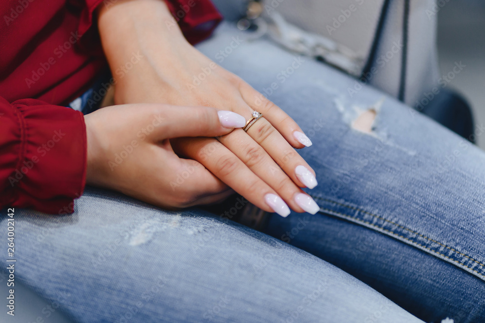 Fototapeta engagement ring with a stone on the gentle bride's hand