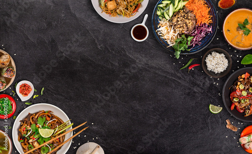 Asian food background with various ingredients on rustic stone background , top view.