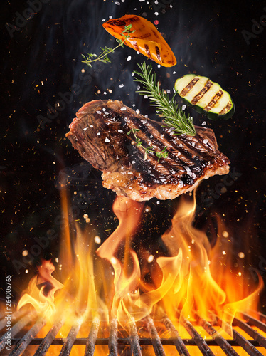 Tasty beef steaks flying ab...