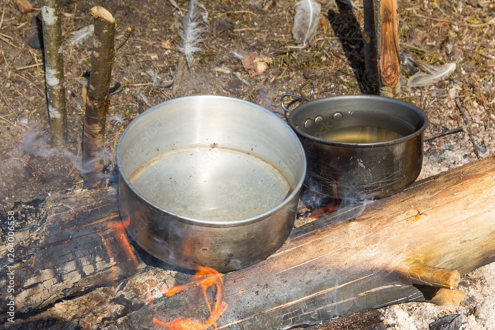boiling water in a pot on the fire boiling water in a pot on the fire