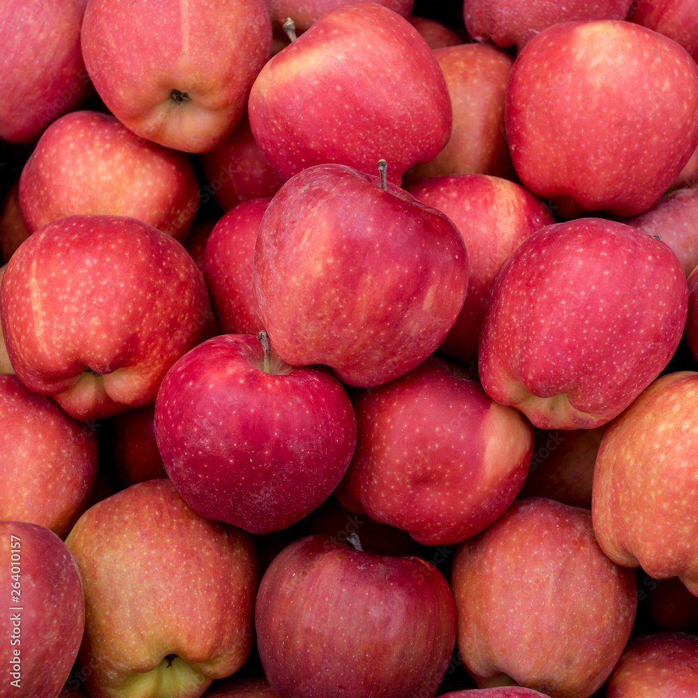 Fresh organic red apples on the farmers market. Close-up apple background. Healthy vegan food. Fresh organic red apples on the farmers market. Close-up apple background. Healthy vegan food.