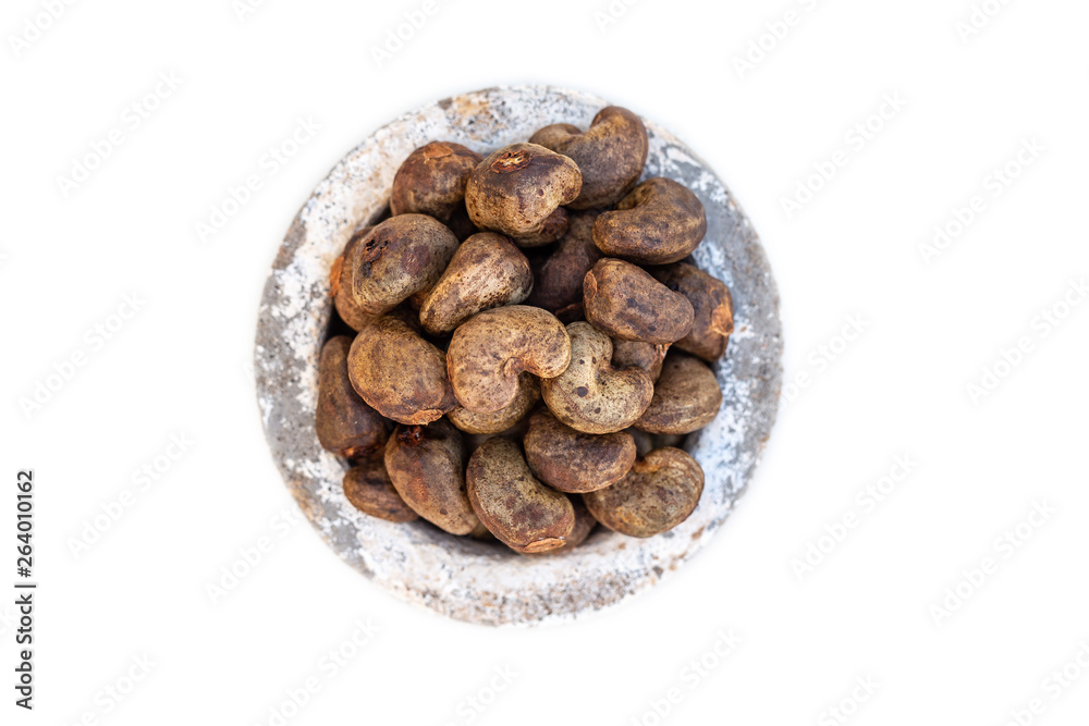 Cashew - bowl filled of raw nuts in the shell Cashew - bowl filled of raw nuts in the shell