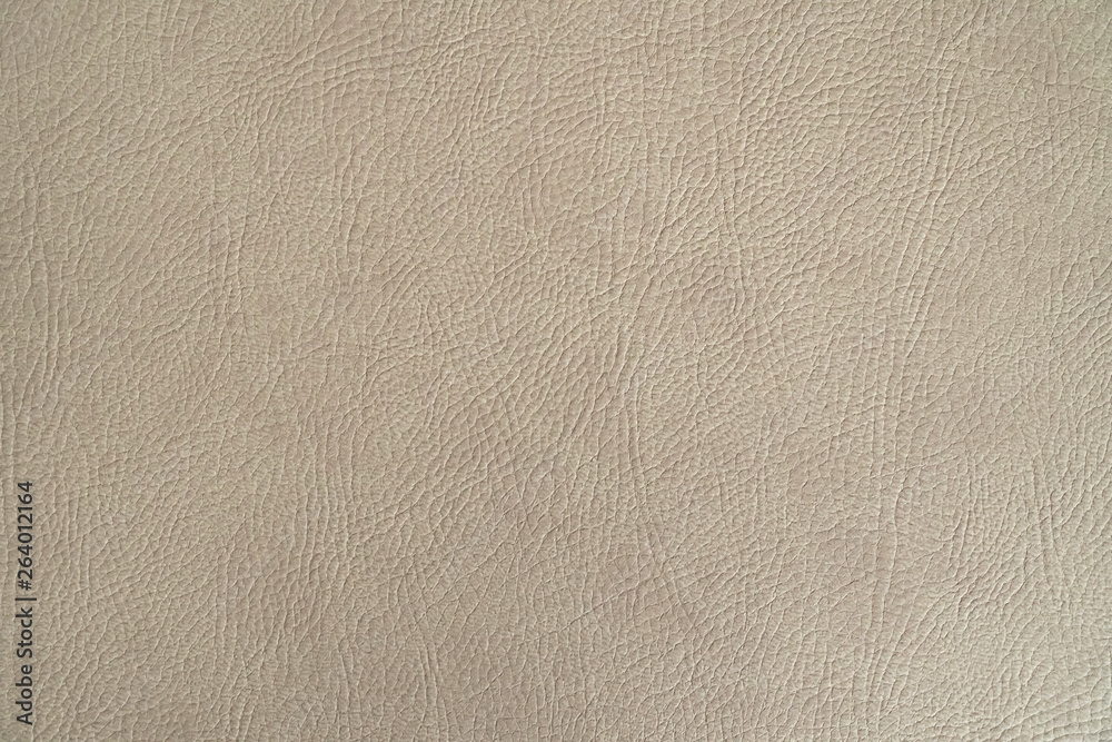 Fototapeta premium Beige leather texture closeup, useful as background.