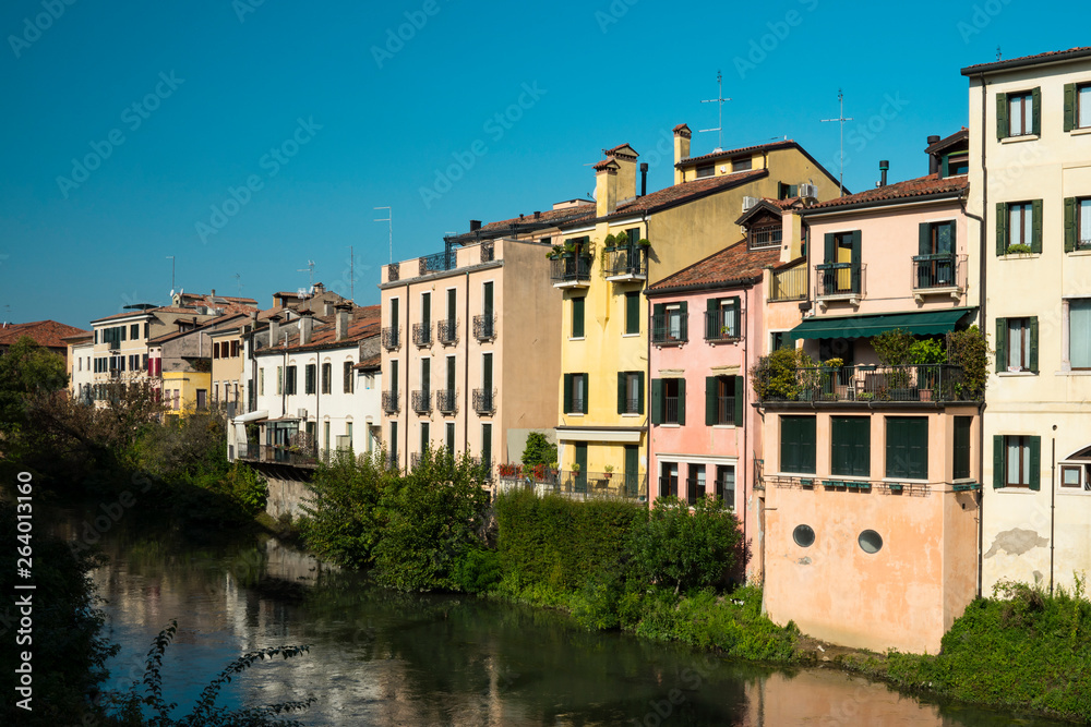 colorful houses along canal in Padua, Italy
