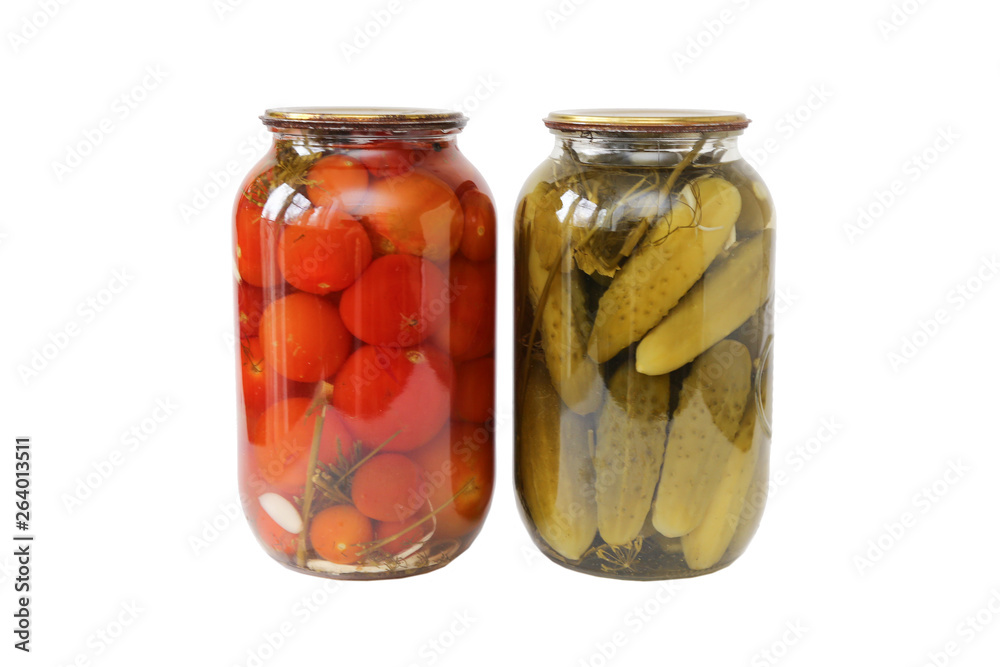 two glass jars with tomatoes and cucumbers closed with a metal lid isolated on white background two glass jars with tomatoes and cucumbers closed with a metal lid isolated on white background