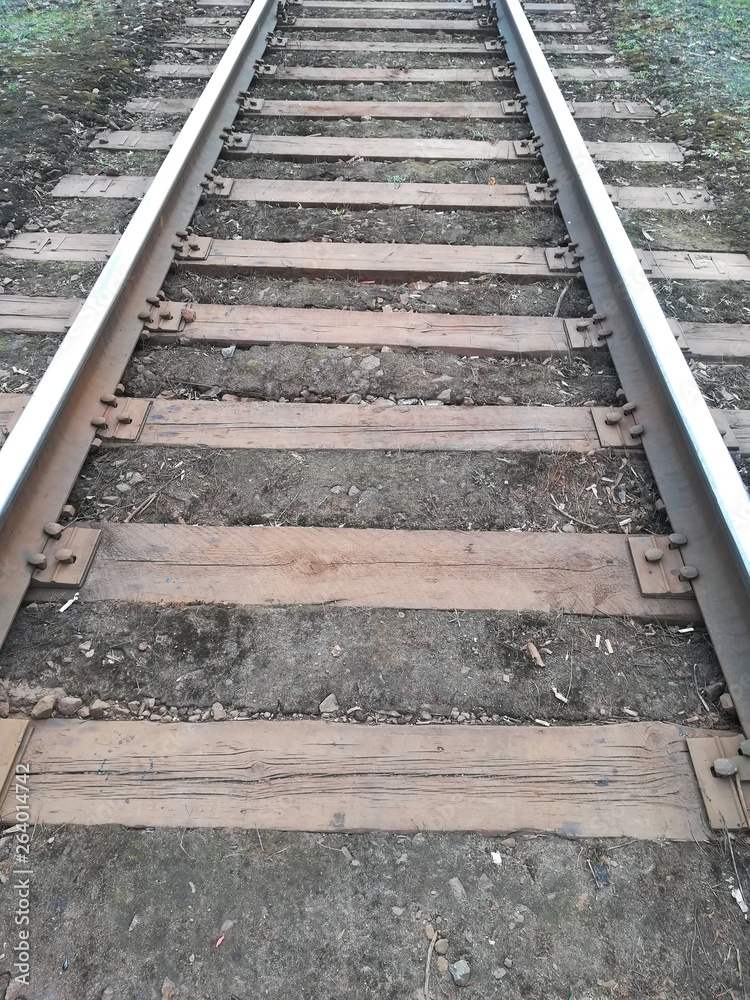 Old railways abstract background. Rails, sleepers close up. Old railways abstract background. Rails, sleepers close up.