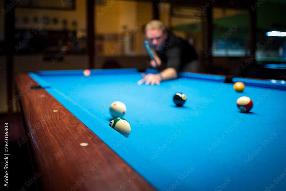 Fototapeta premium A man plasy Pool Billiard