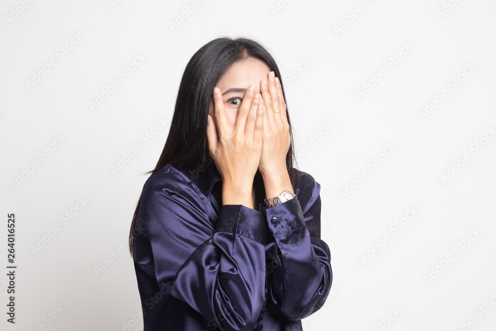 Beautiful young Asian woman peeking through fingers. Beautiful young Asian woman peeking through fingers.