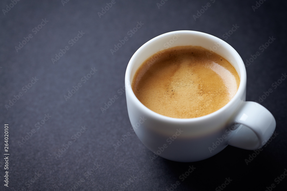 Cup of coffee on black background. Copy space. Cup of coffee on black background. Copy space.
