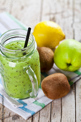 Green smoothie with kiwi, apple, lemon and chia seeds. Healthy fresh diet eating, superfood.
