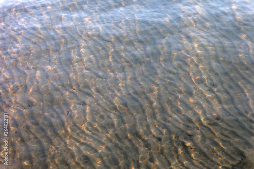 Patterns of sand made of waves on the bottom of the sea