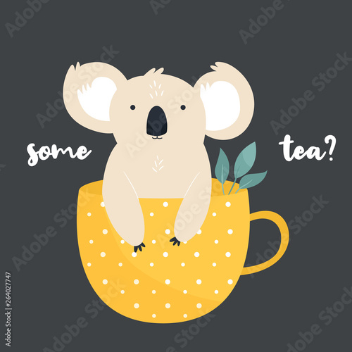 Funny koala sittiting in a tea cup.