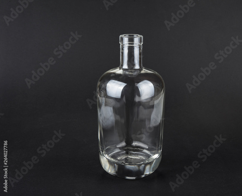Empty spirit bottle on a black background