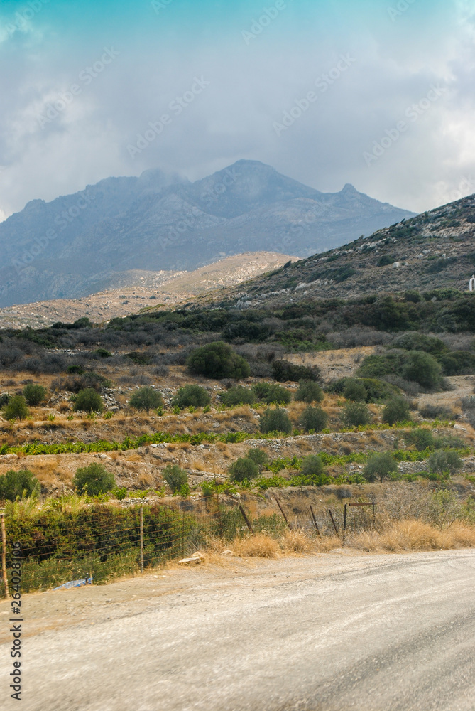 Mountain road on Naxos Island in summer day. Cyclades, Greece