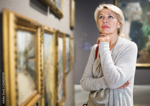 Woman looking at picture collection