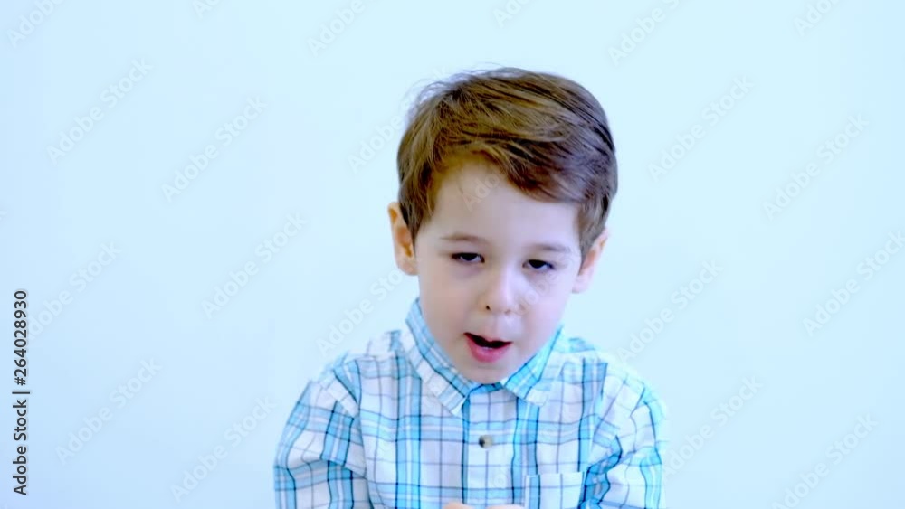 Three years old kid and emotions, close-up portrait of happy smiling kid looking at camera at white background Three years old kid and emotions, close-up portrait of happy smiling kid looking at camera at white background