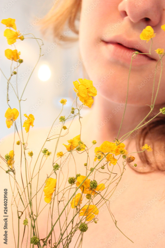 Girl with yellow flowers