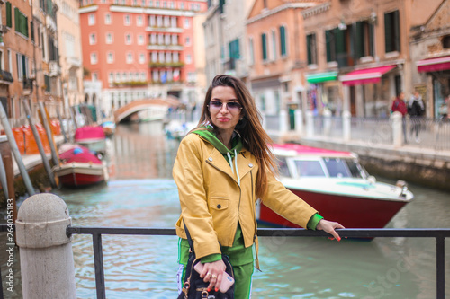 girl on Venice stress with Canal and city view 