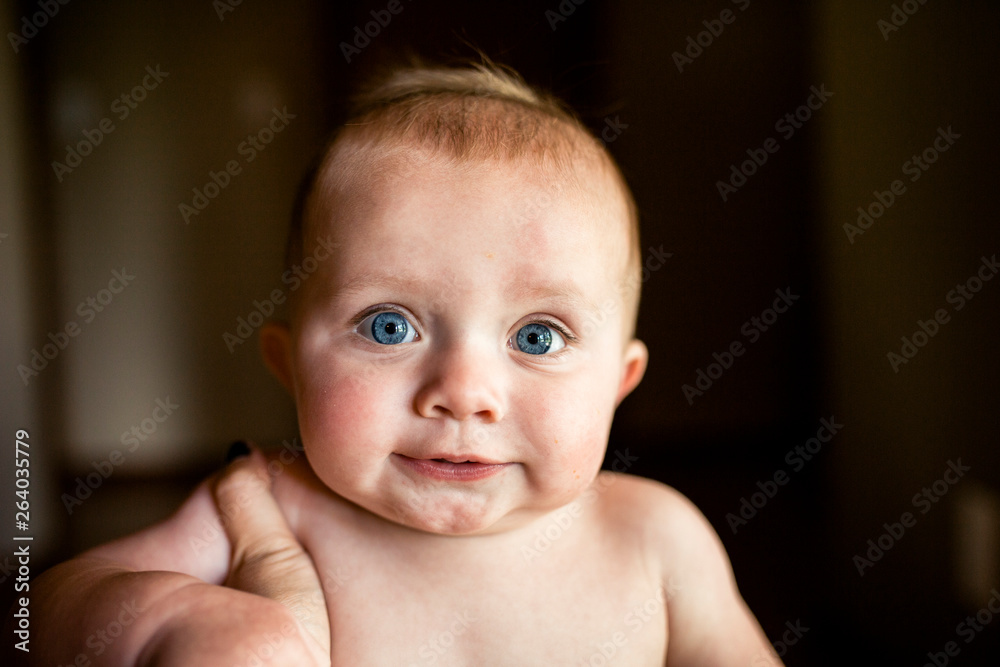 Portrait of shirtless baby boy smiling and looking straight at camera Portrait of shirtless baby boy smiling and looking straight at camera