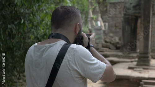 Photographer doing photos of old, historical ruins photo