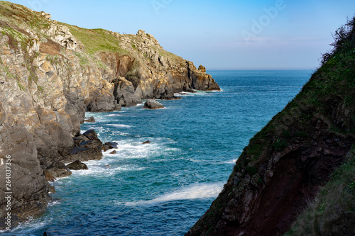 stone ocean coast and blue sky