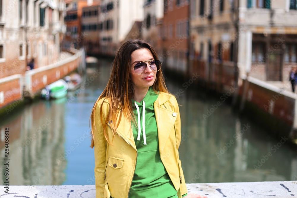 girl on Venice street with canal background. and streets 