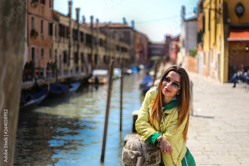young woman on Venice canal background 