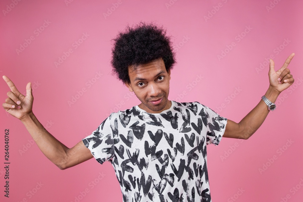 African man showing thumbs up standing on pink background African man showing thumbs up standing on pink background