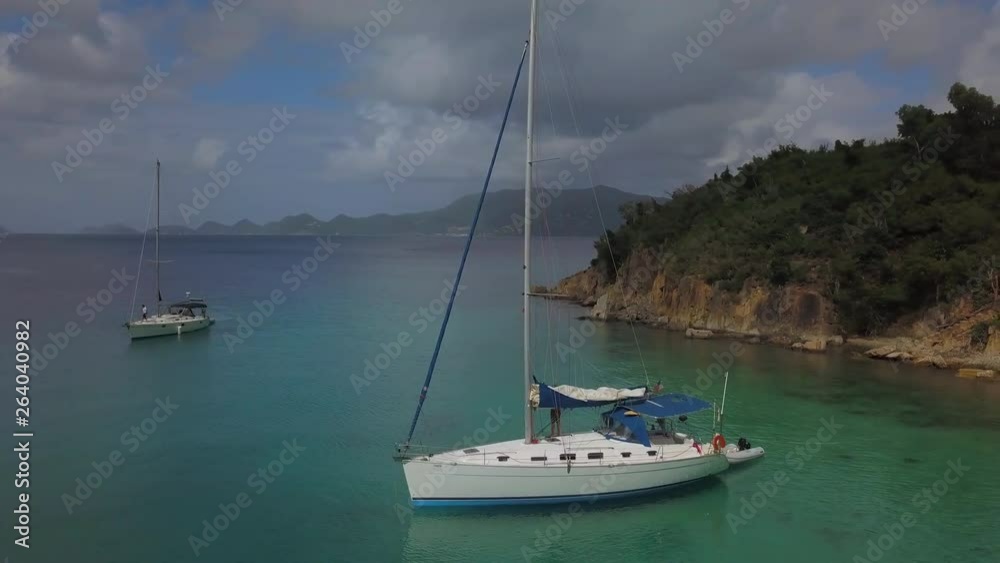 Aerial: Two Sailboats Anchored in near Shore in Caribbean in St. Croix, US Virgin Islands Aerial: Two Sailboats Anchored in near Shore in Caribbean in St. Croix, US Virgin Islands