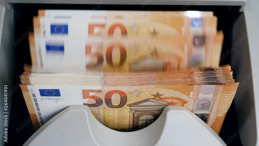 Money-counting machine with euros in it