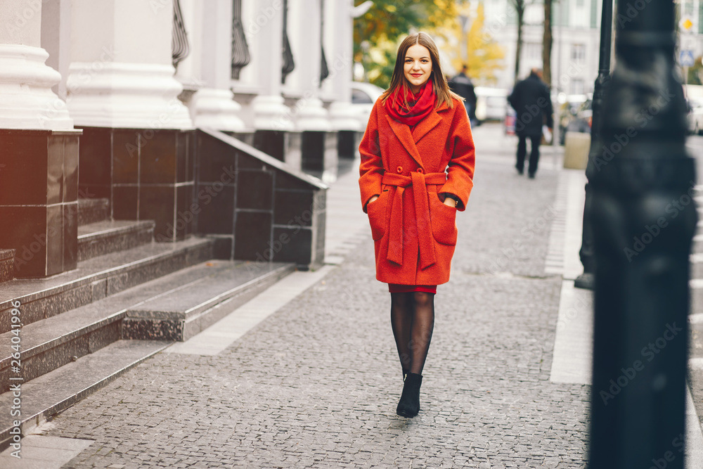 Fototapeta premium beautiful and stylish girl walking around the summer city