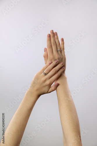 beautiful woman hands with manicure showing rings