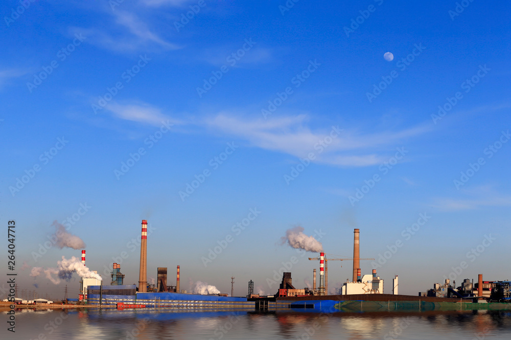 A chemical plant against a blue sky