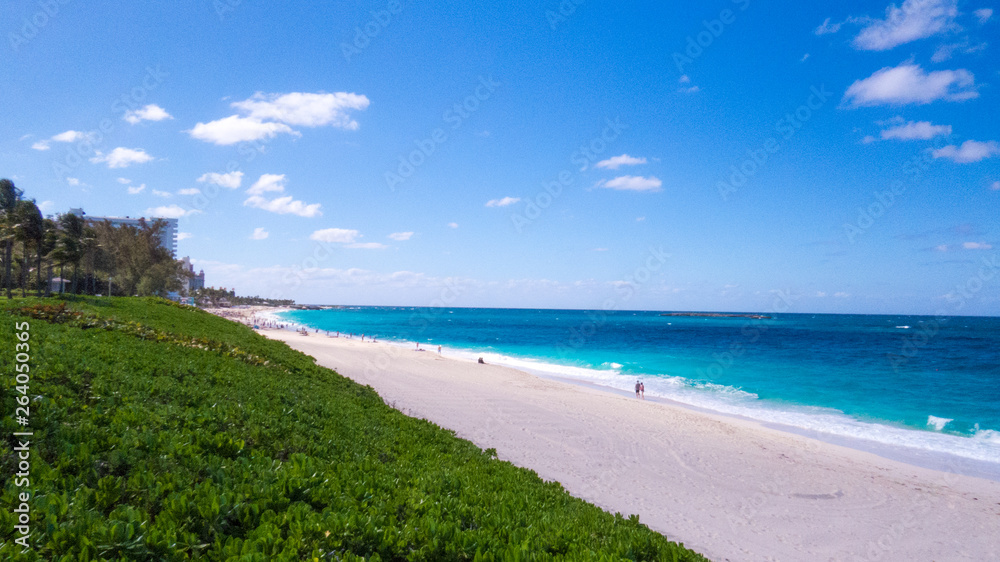 Sunny day over a beautiful beach from Nassau and the Atlantic Ocean. Paradise Island, The Bahamas. Sunny day over a beautiful beach from Nassau and the Atlantic Ocean. Paradise Island, The Bahamas.