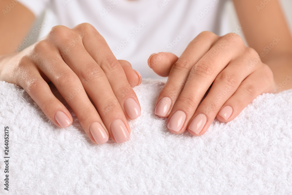 Closeup view of beautiful female hands on towel. Spa treatment