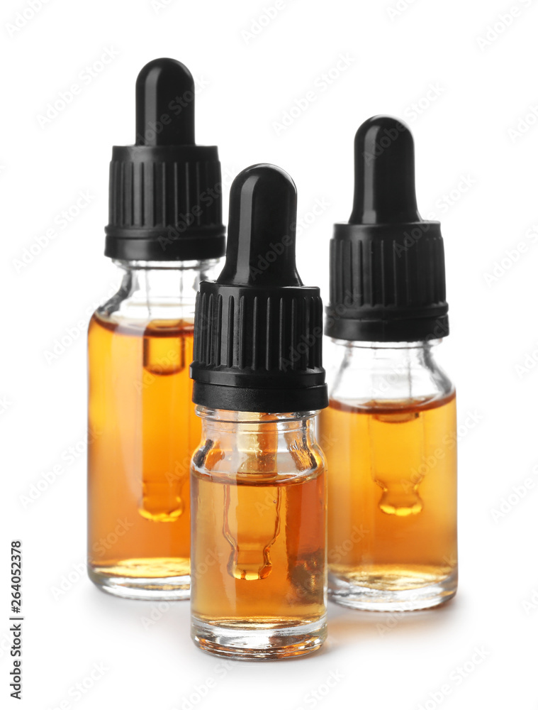 Bottles of essential oil isolated on white Bottles of essential oil isolated on white