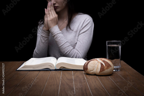 Woman praying indoors