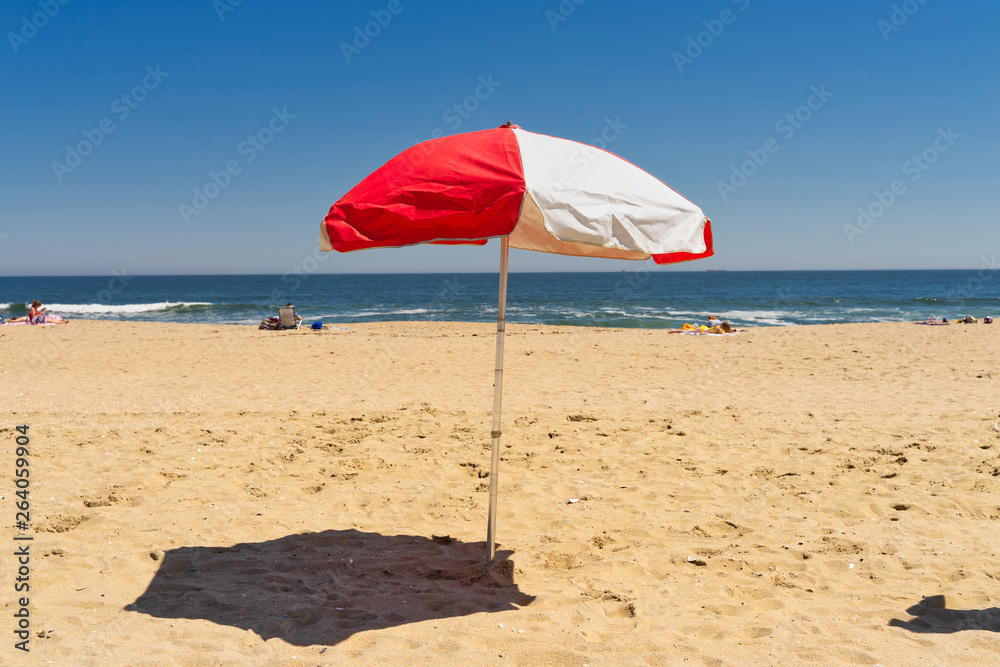 Sunny day at the beach with umbrella