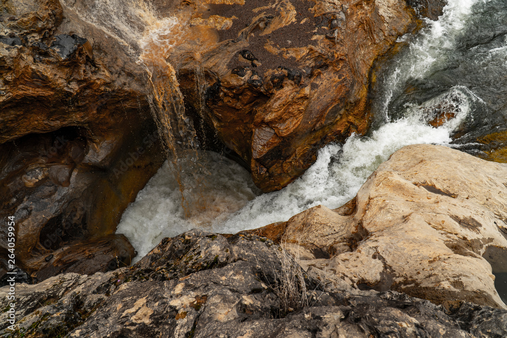 Beautiful view of a mountain river flowing between the fantastic sculptural rocks in Turkey. Beautiful view of a mountain river flowing between the fantastic sculptural rocks in Turkey.